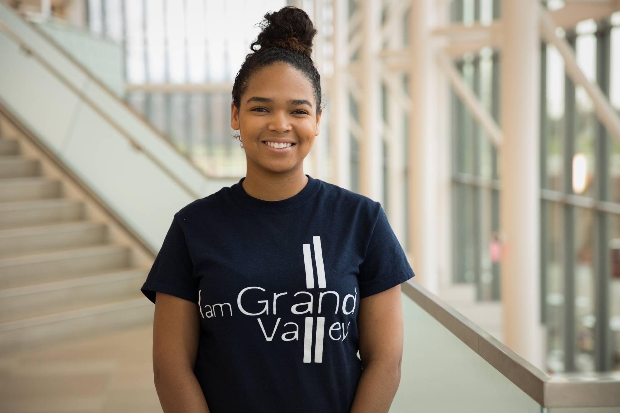 "I am Grand Valley" student recipient head-shot in Mary Idema Pew Library